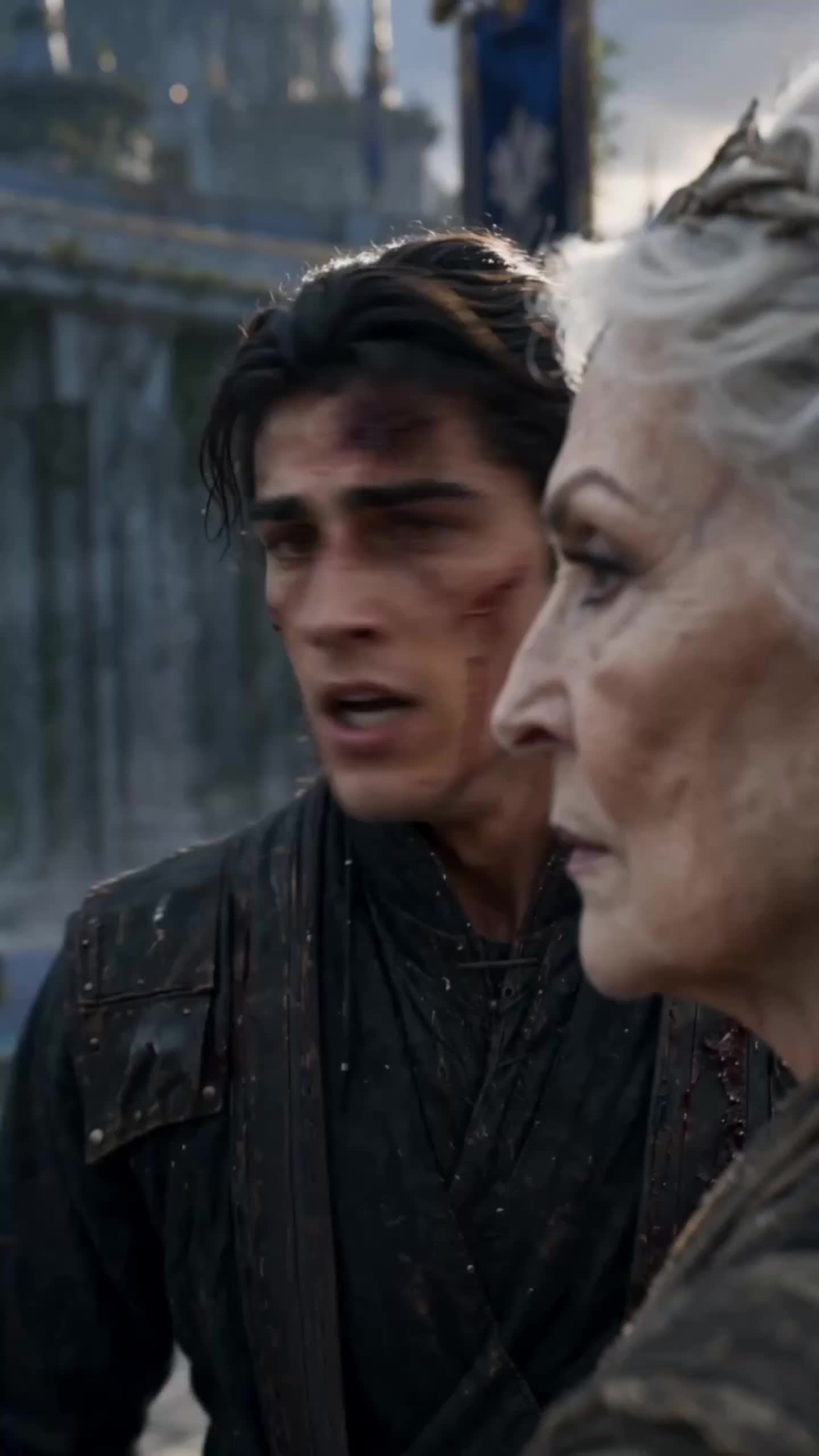 Cedric, wet, with cuts on his cheek and forehead, in a dark leather coat, looking at a white-haired old woman in a grey robe seen in profile beside him
